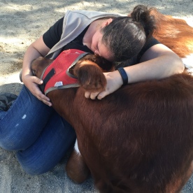 Volunteer Val cuddles with sweet Sage.